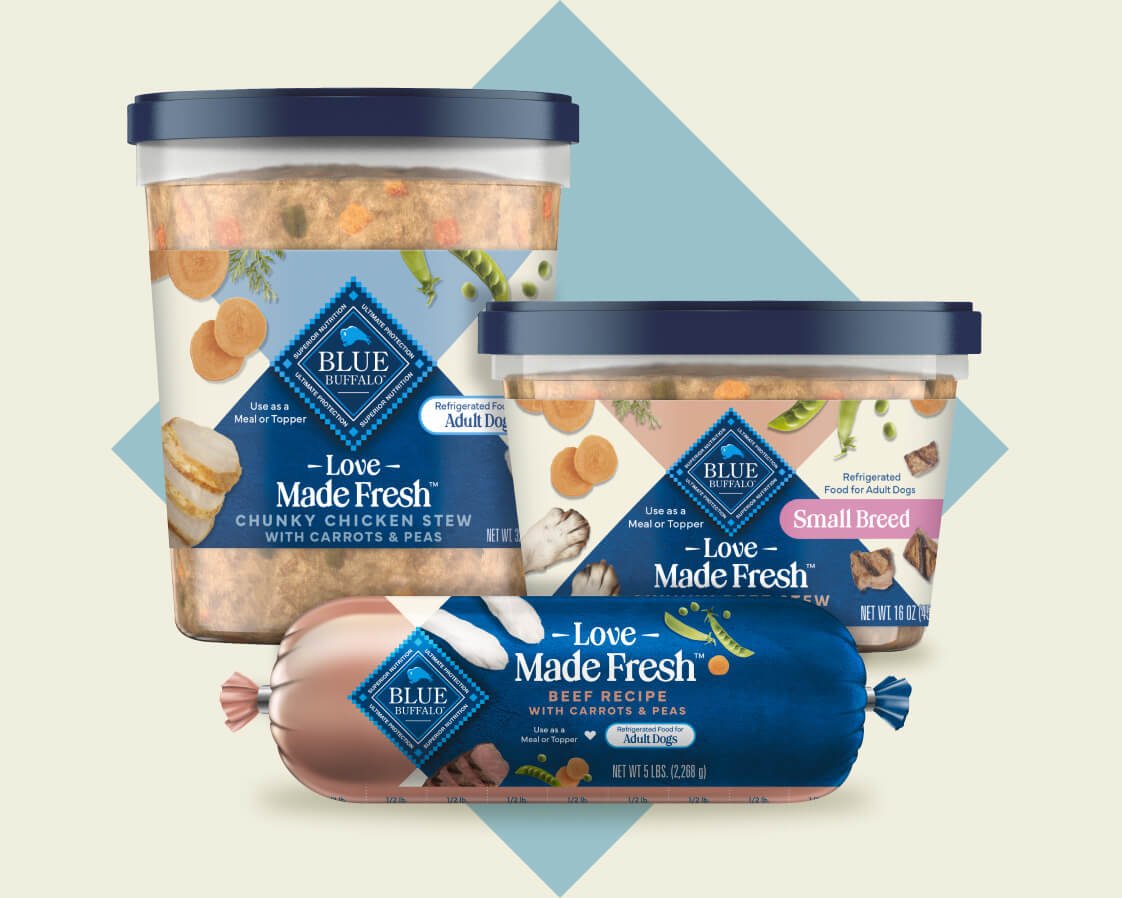 Two tubs and a roll of BLUE Love Made Fresh refrigerated dog food.