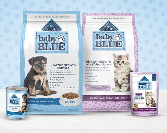 A variety of Baby Blue pet food products, including dry puppy and kitten formulas, a can, and a pack of kitten treats.