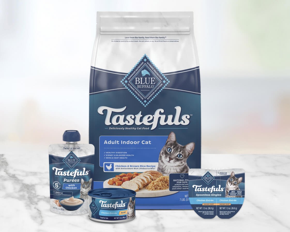 A variety of Blue Buffalo Tastefuls cat food products, including dry food, canned food, puree, and single-serve cups.