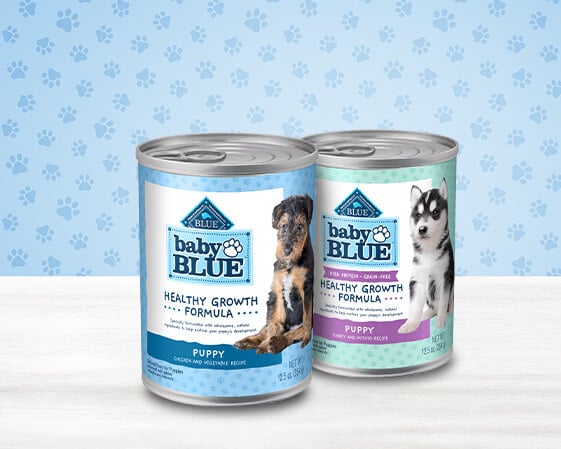 cans of baby blue dog wet food for puppies