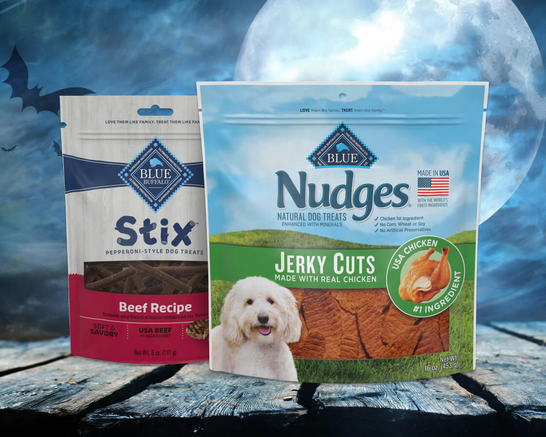 Blue Buffalo Meaty dog treats packaging with festive Halloween elements, promoting natural, high-quality ingredients.