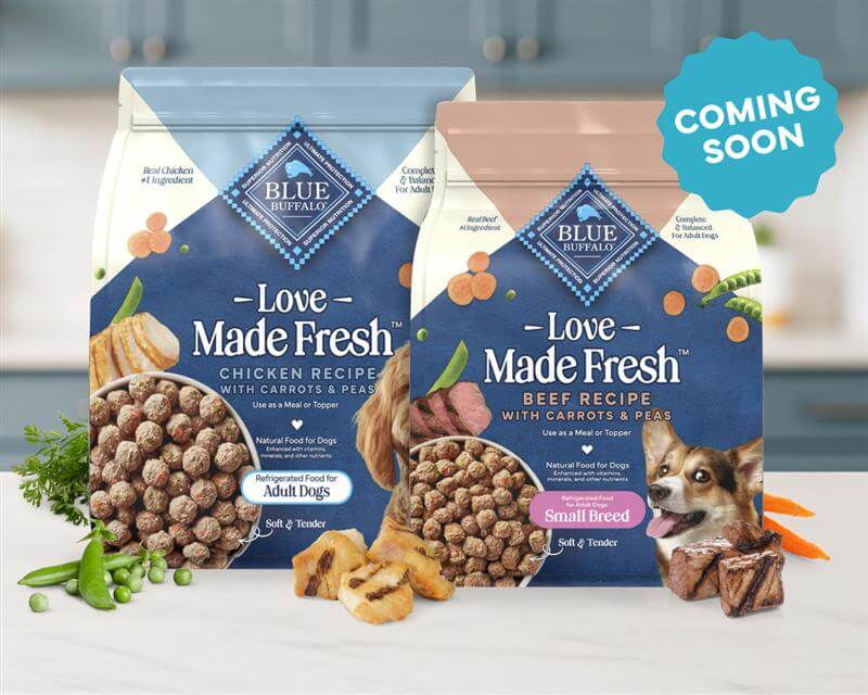 A BLUE recipe is shown next to tasty, real vegetables and tender cuts of meat on a kitchen counter.