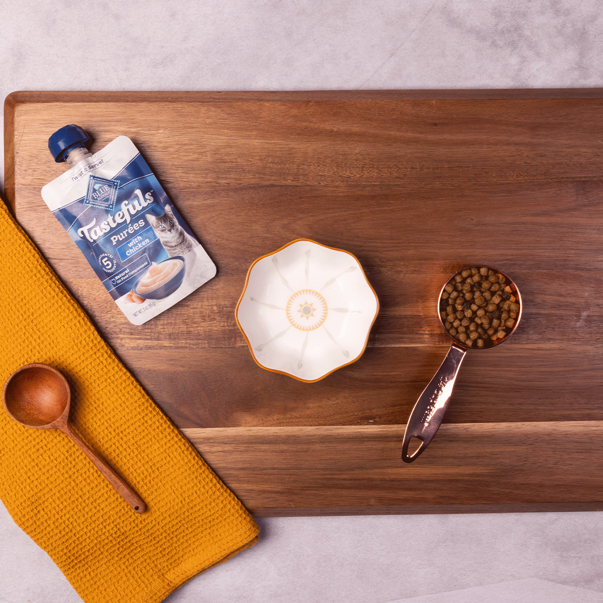 A GIF shows the ingredients being mixed to create a dog-friendly recipe.