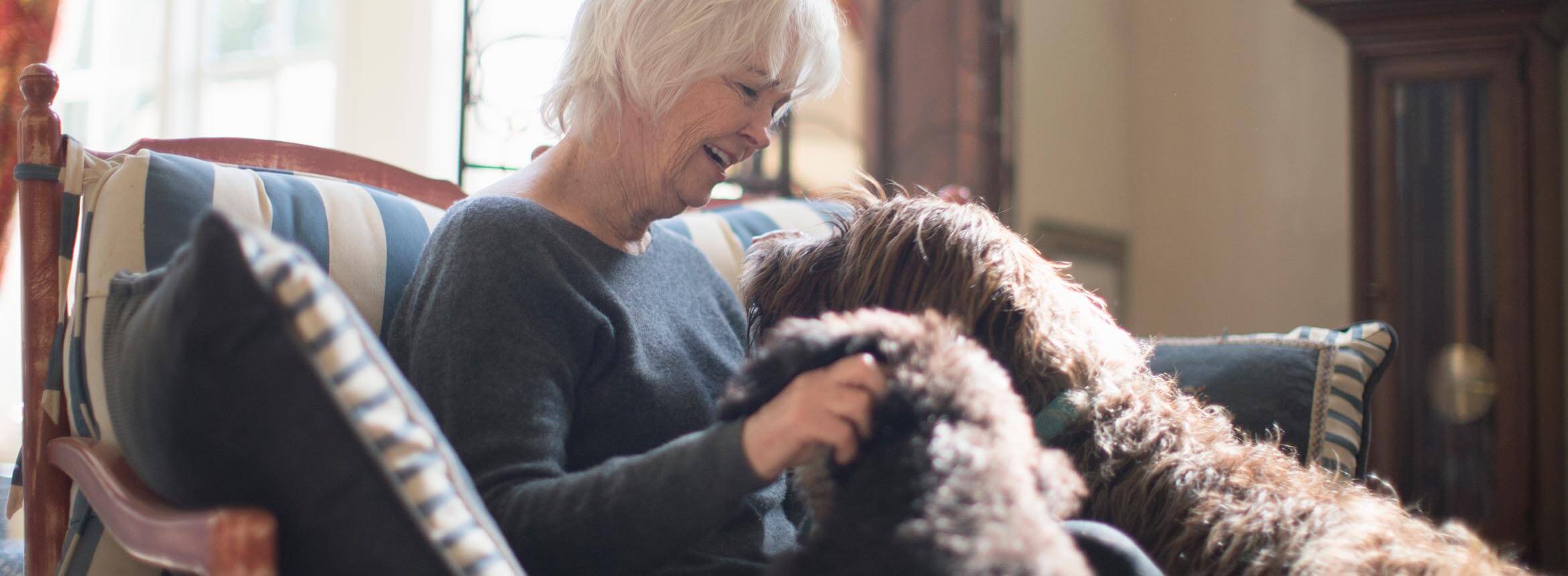 image of elder with a dog