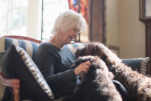 image of elder with a dog