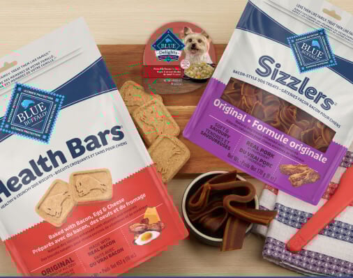 Assortment of Blue Buffalo dog treats: Health Bars, Sizzlers, and Blue Delights.