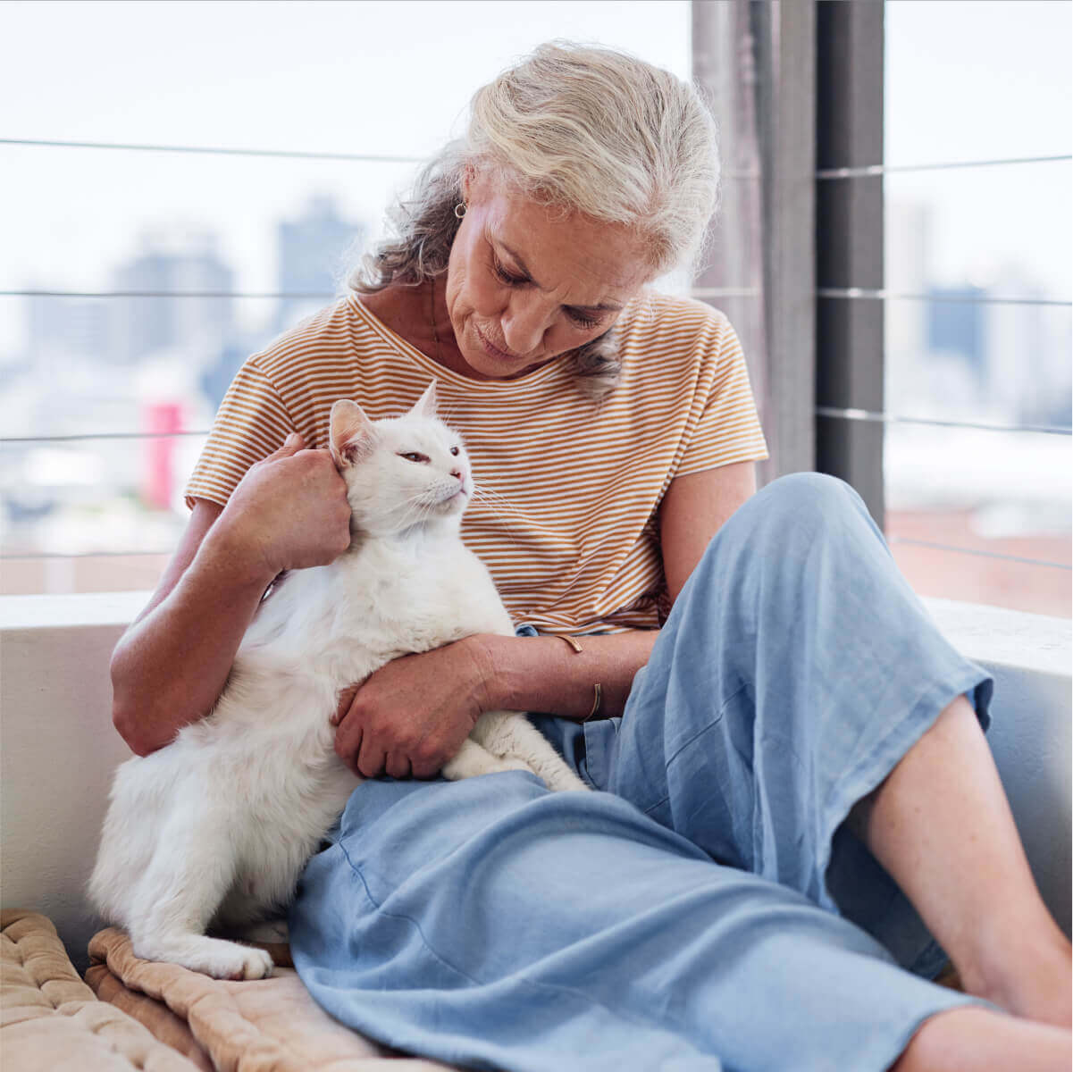 A lady holding a cat