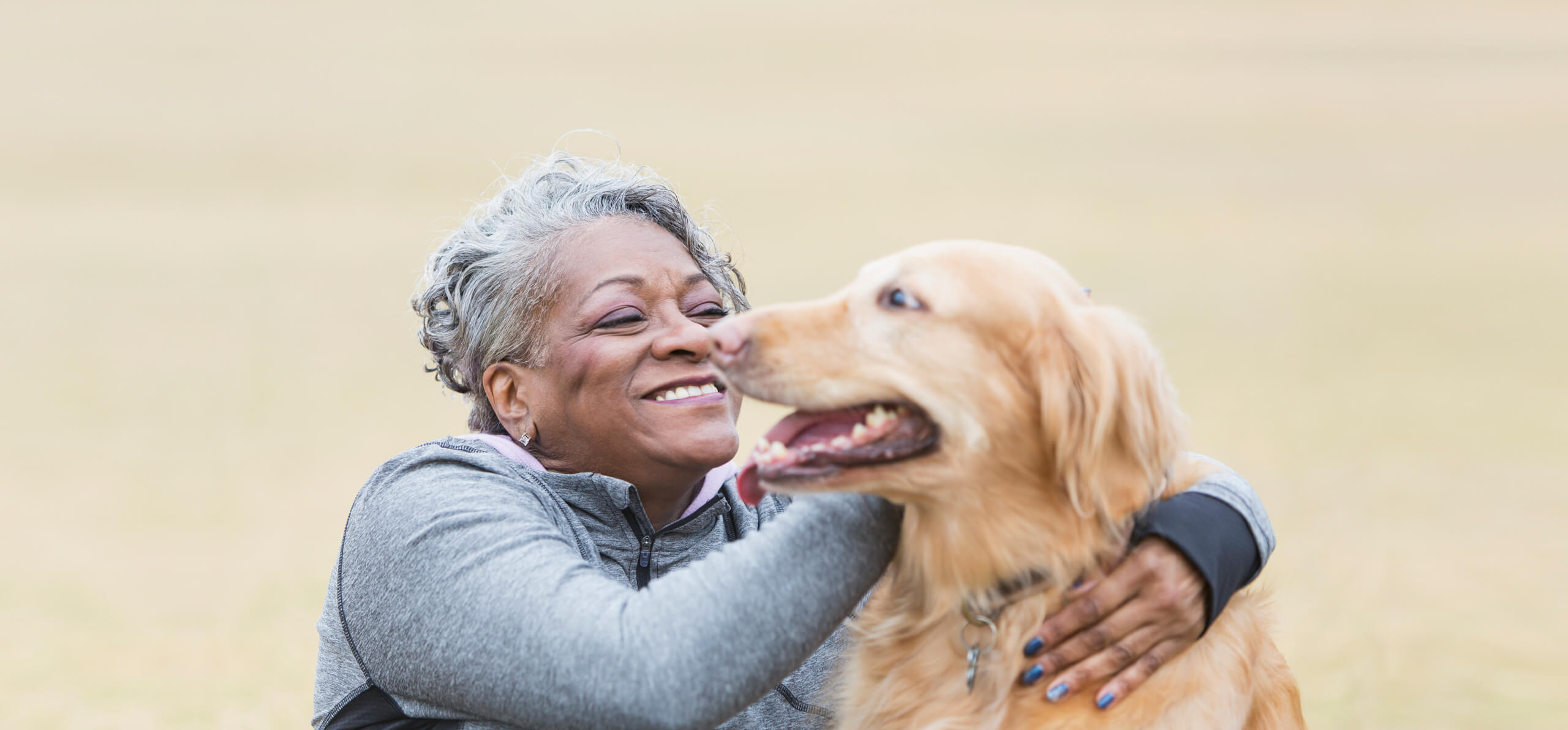 lady and dog smiling at each other