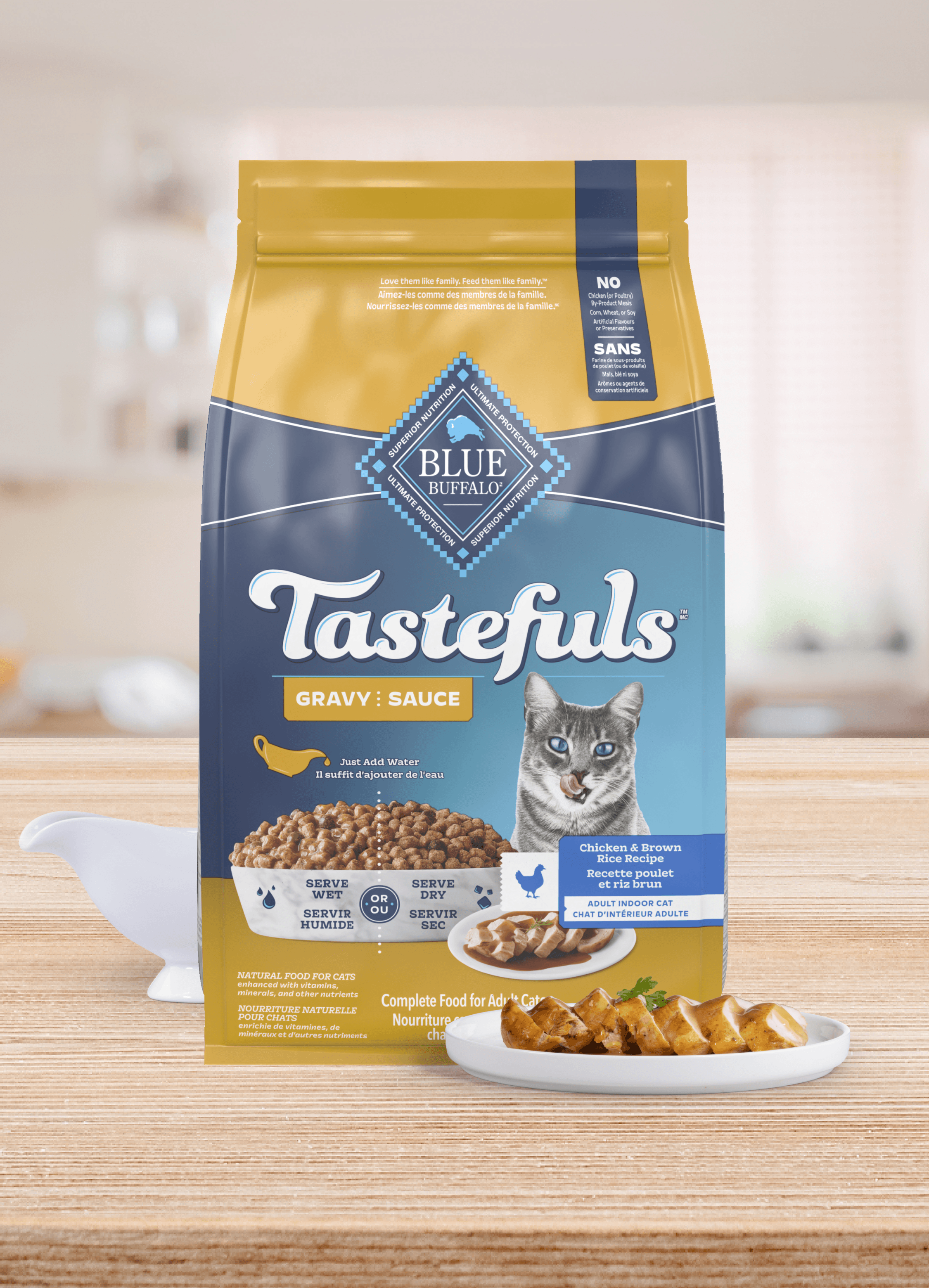 A bag of Tastefuls Gravy cat food sits on a table next to a plate of cat food and a gravy boat.