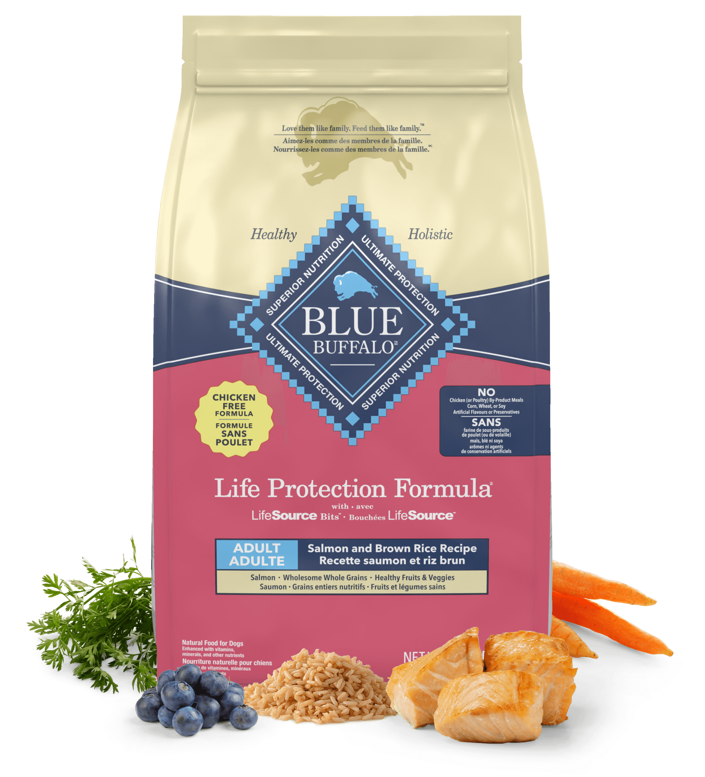 A bag of BLUE dry dog food is surrounded by fresh parsley, blueberries, grains, salmon fillets and carrots.