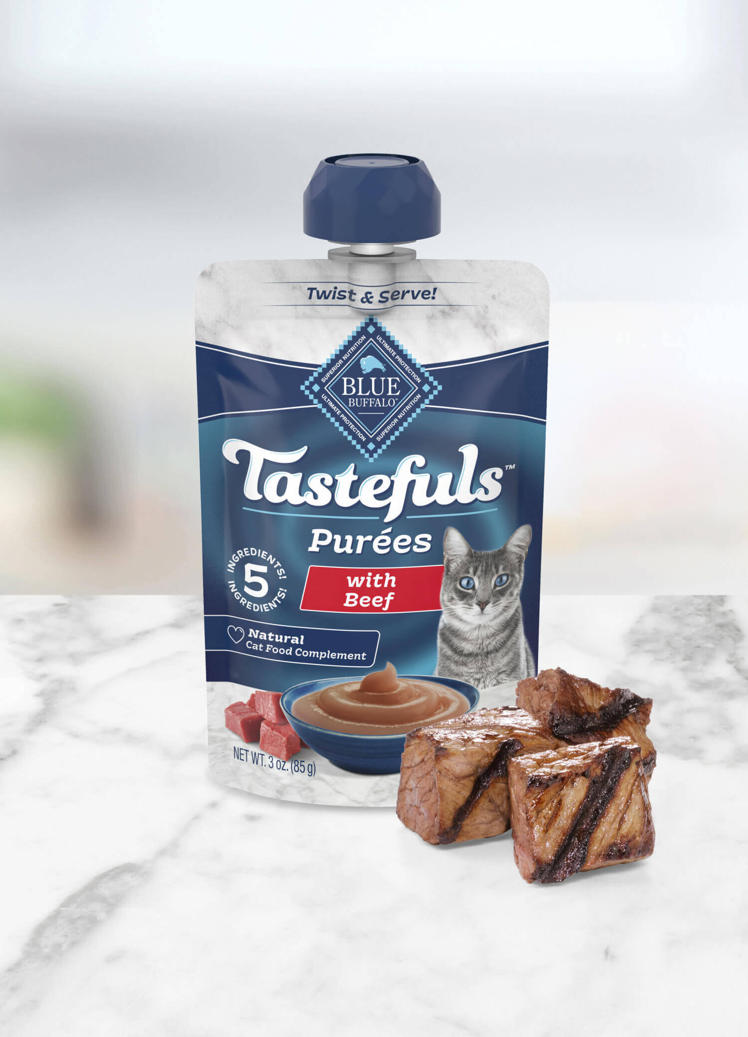 A pouch of BLUE Tastefuls Purées Beef and a few cuts of grilled steak.