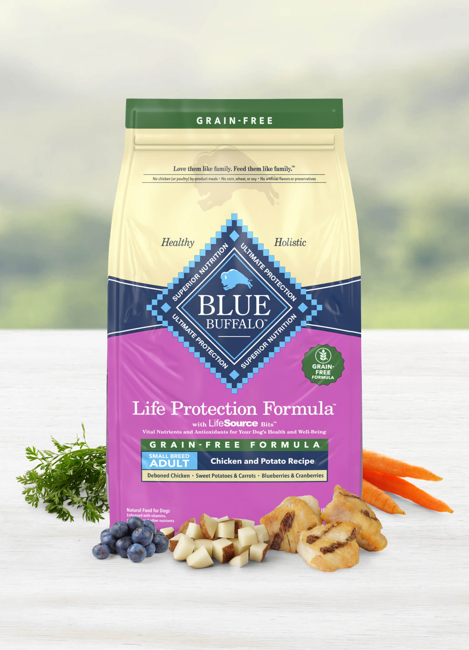 Grain-free adult dog food, chicken and potato recipe, with wholesome ingredients shown in front.