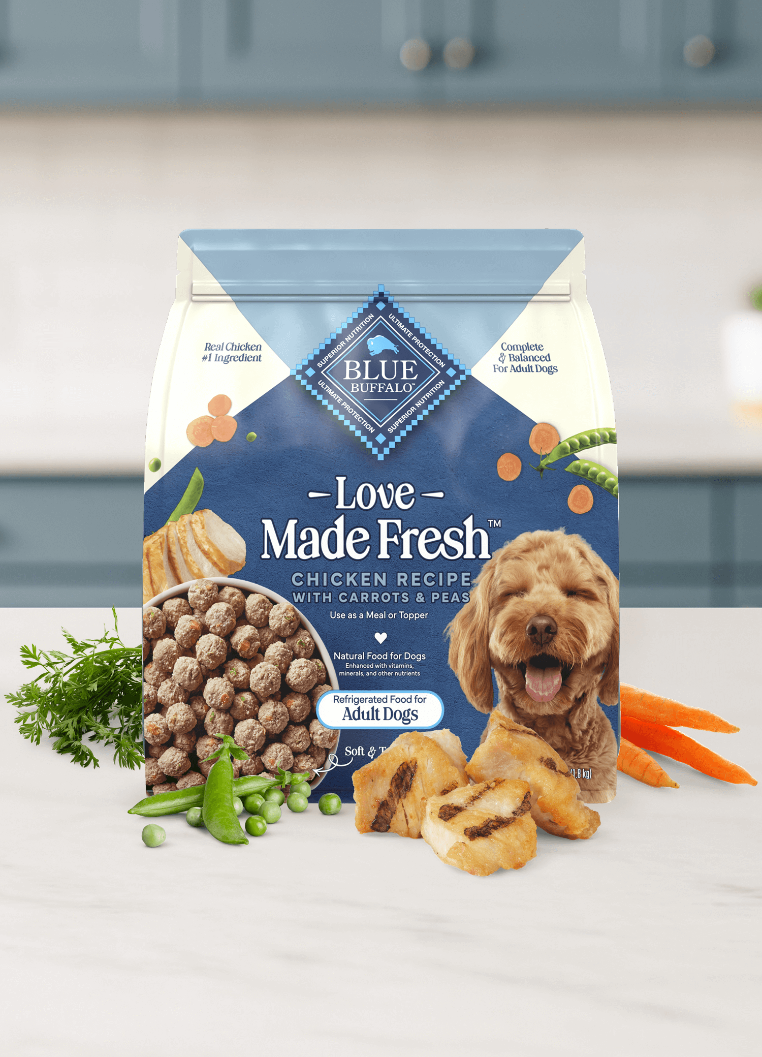 Love Made Fresh chicken recipe dog food with carrots, peas, and chicken pieces on a kitchen counter.