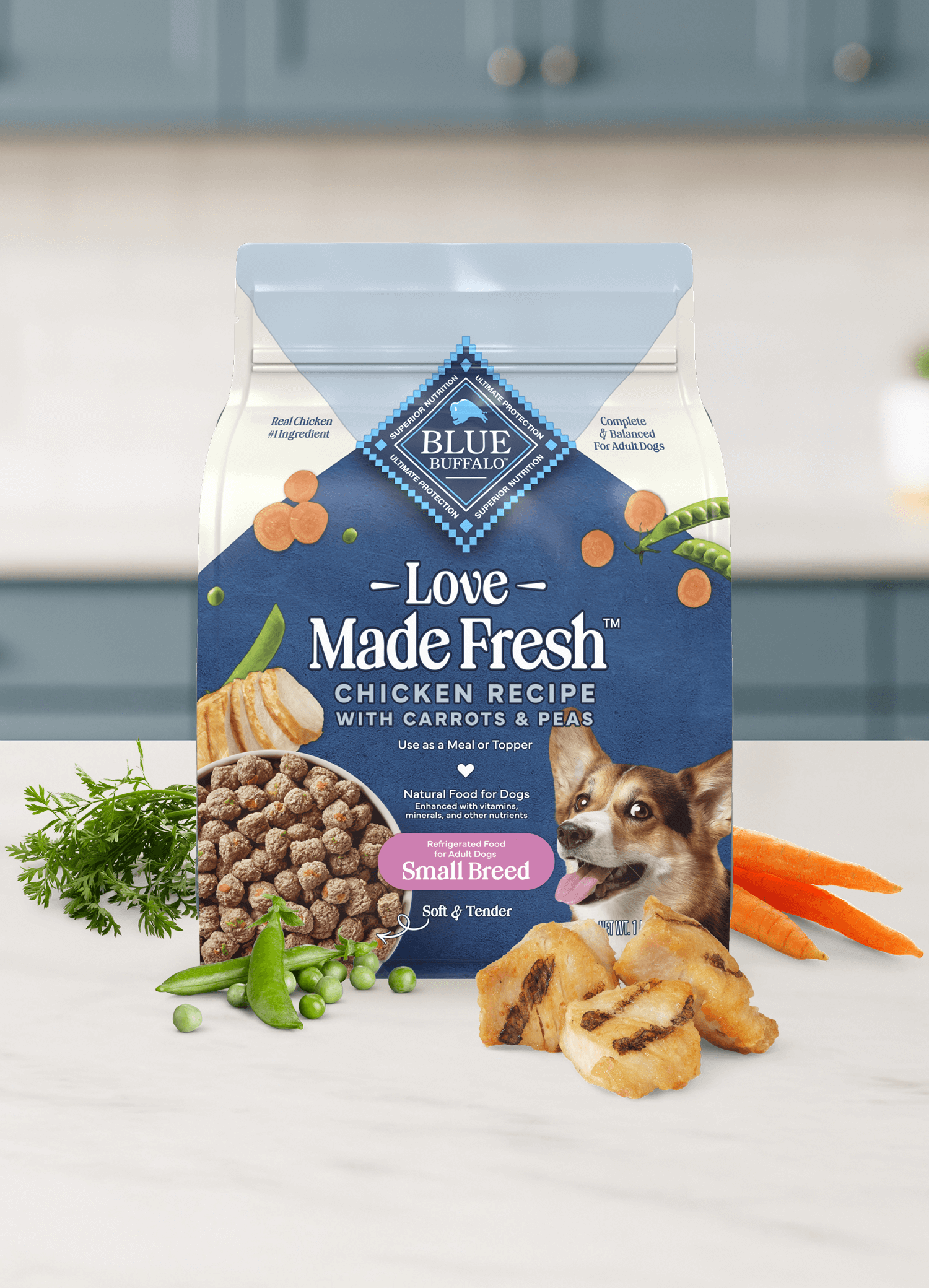 A bag of Love Made Fresh chicken dog food with carrots and peas sits on a kitchen counter.