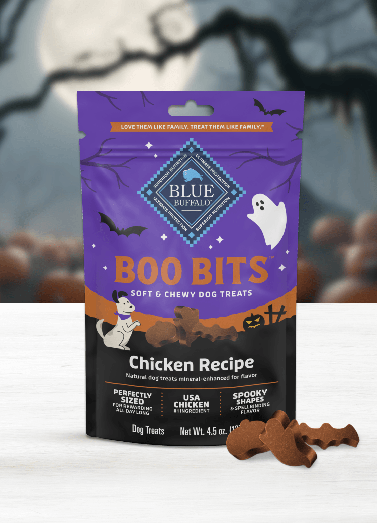A bag of Boo Bits chicken dog treats with a Halloween theme, featuring bats, ghosts, and pumpkins.