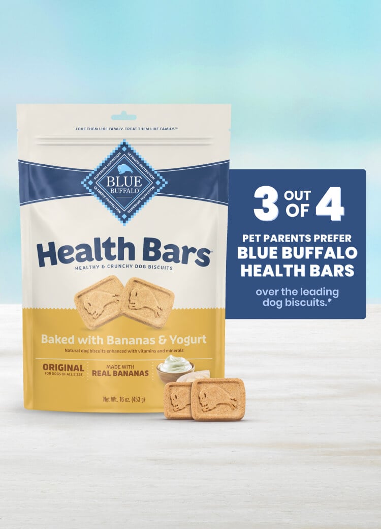 A bag of Health Bars dog biscuits with bananas and yogurt, with two biscuits on a table.