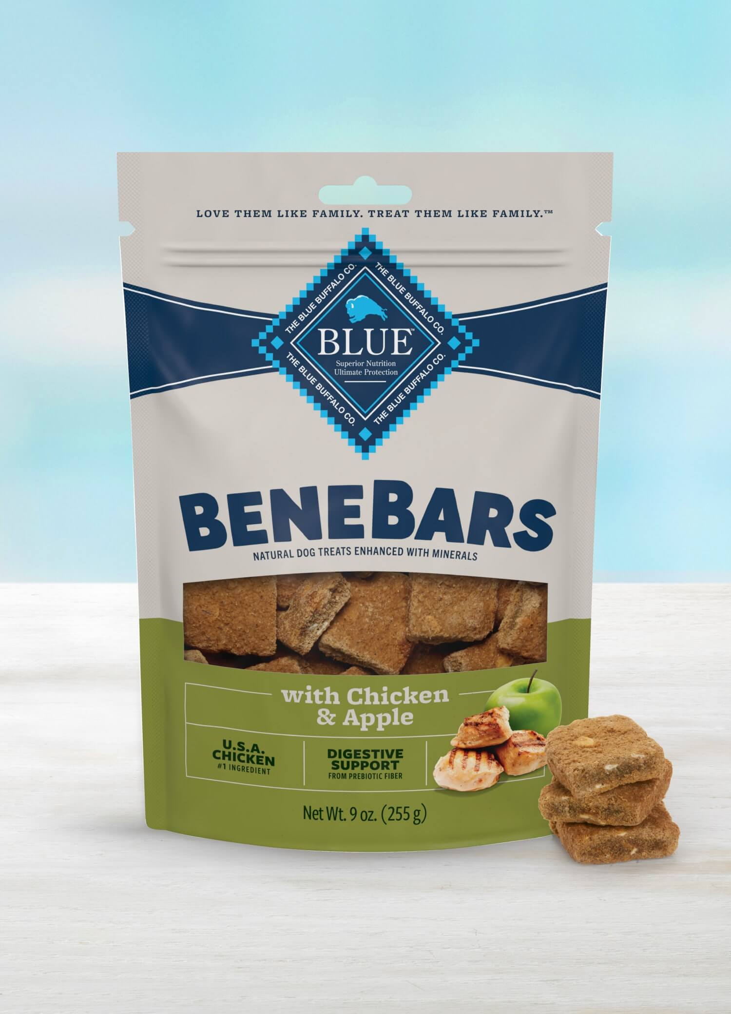 A bag of BeneBars dog treats with chicken and apple flavor sits on a light-colored surface.