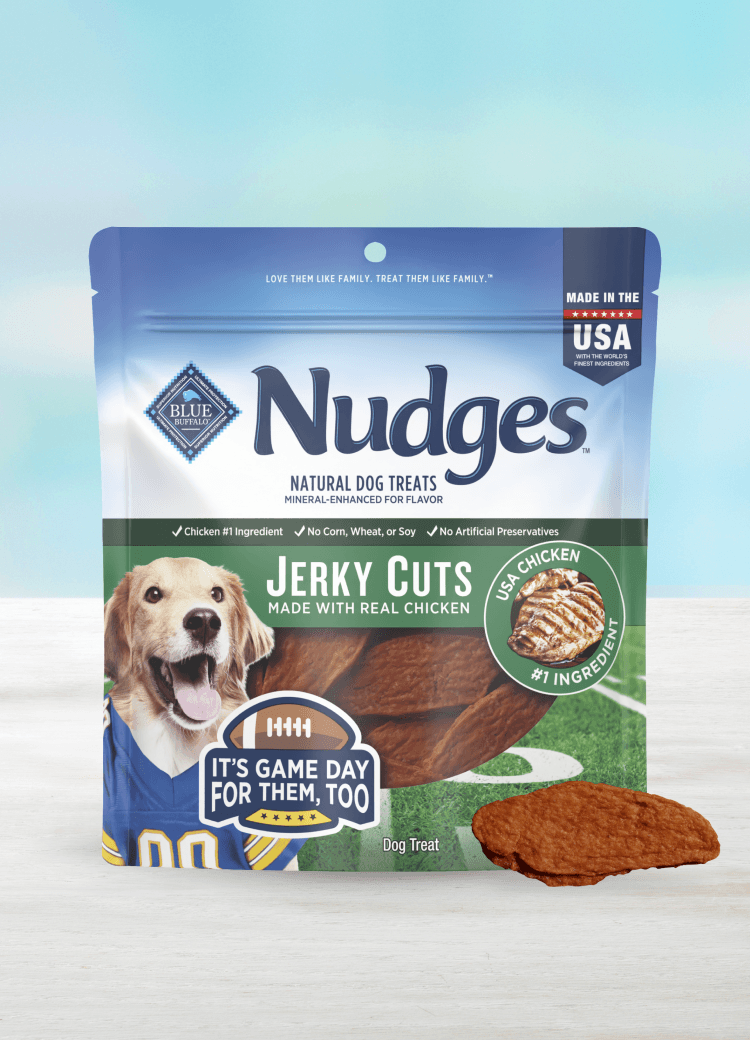Blue Buffalo Nudges Jerky Cuts natural dog treats, made with real chicken; bag features a golden retriever in a jersey