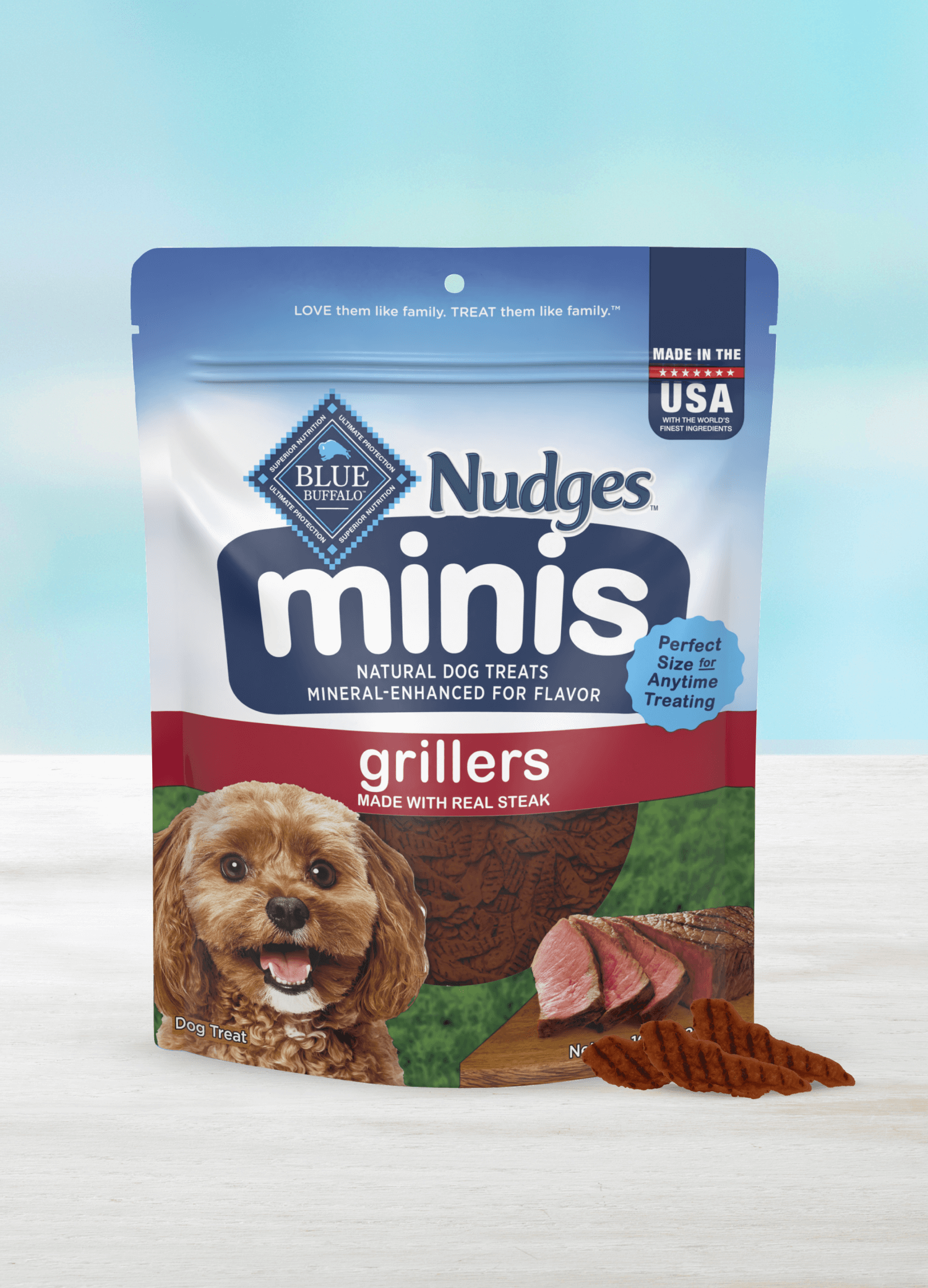 A pack of BLUE Nudges minis grillers made with real beef and a few loose Nudges mini treats.