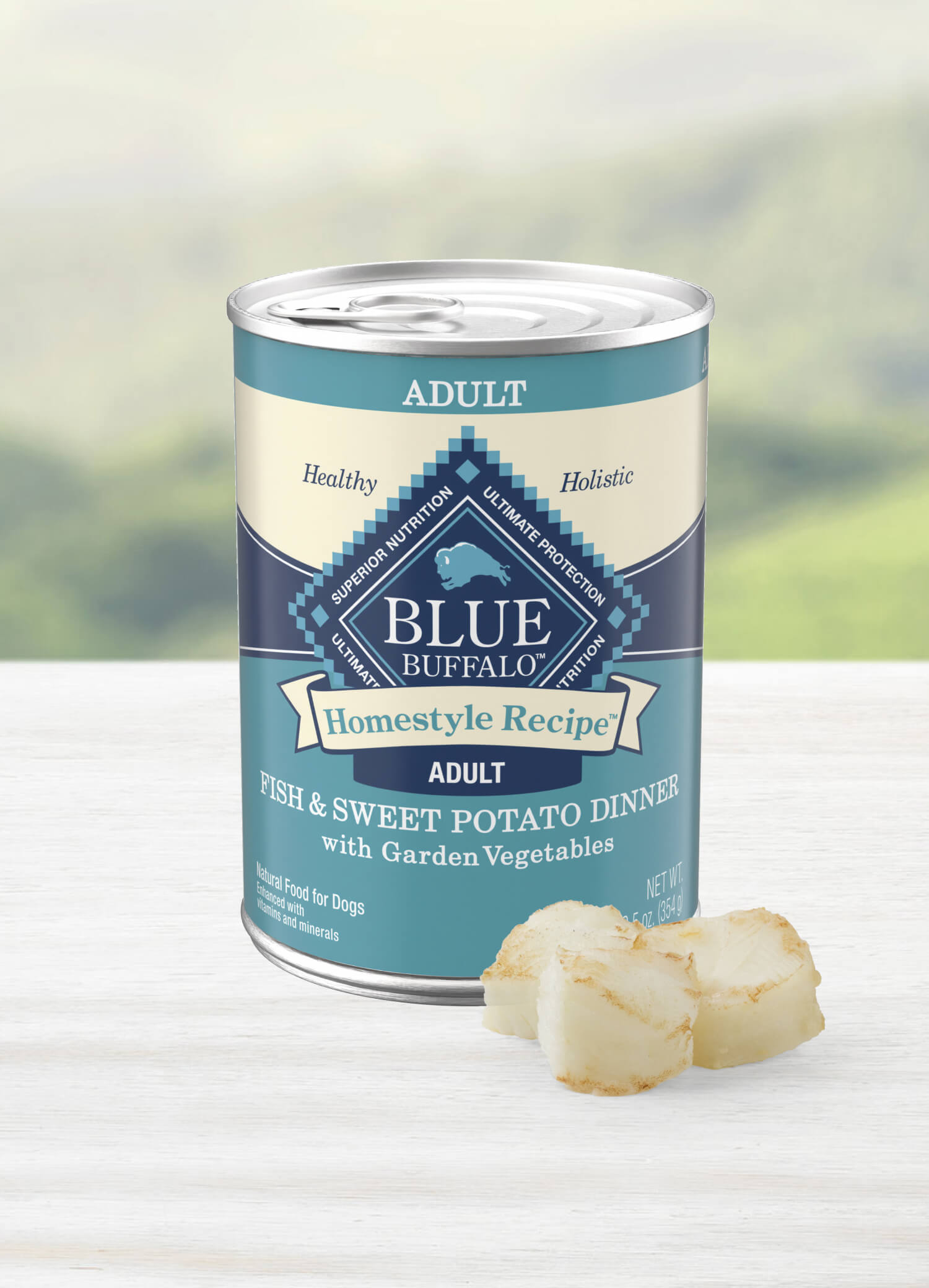 Dog food can labeled "Homestyle Recipe," Fish & Sweet Potato Dinner with garden vegetables for adult dogs.